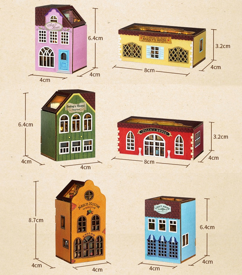 a group of toy houses with different colors and sizes